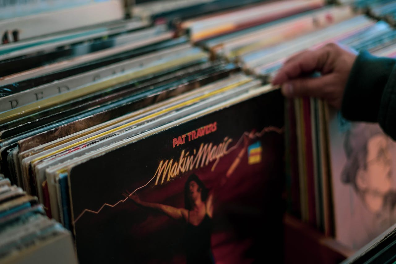 about-header Person browsing vinyl records collection in a Cambridge store. Nostalgic and retro vibe.