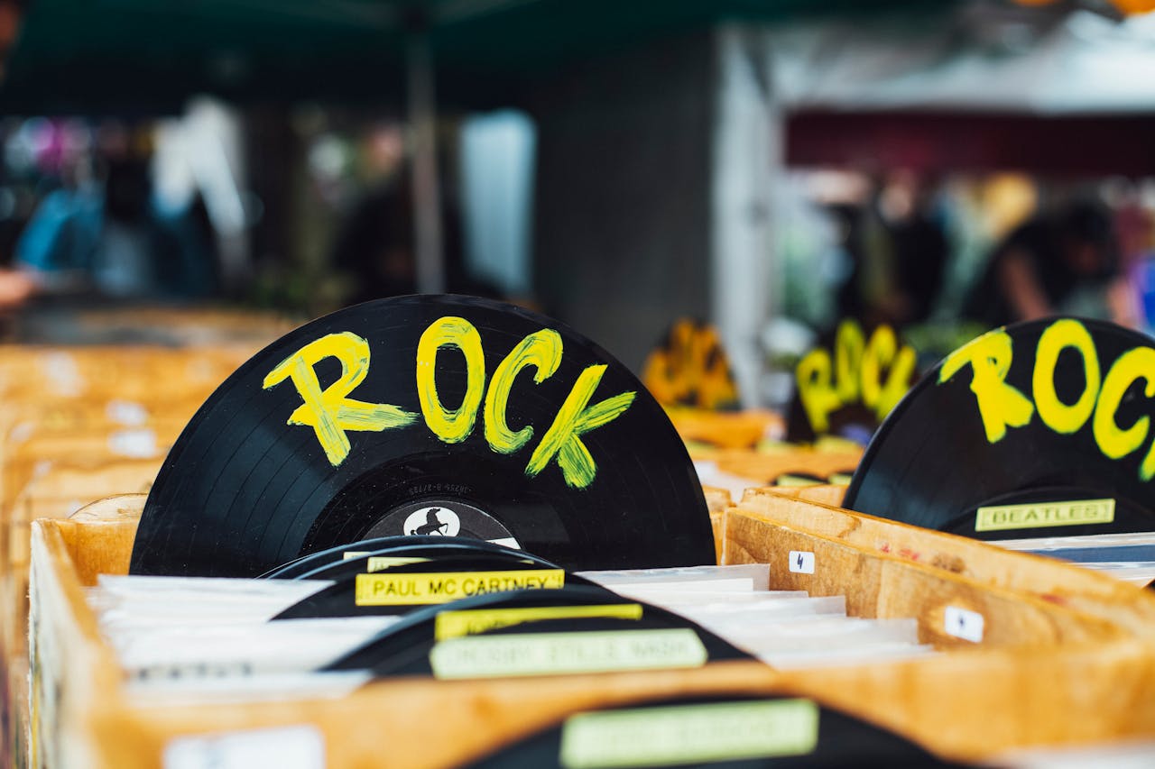 why-choose-us Colorful vinyl records labeled 'Rock' in a vintage music shop, perfect for music enthusiasts.