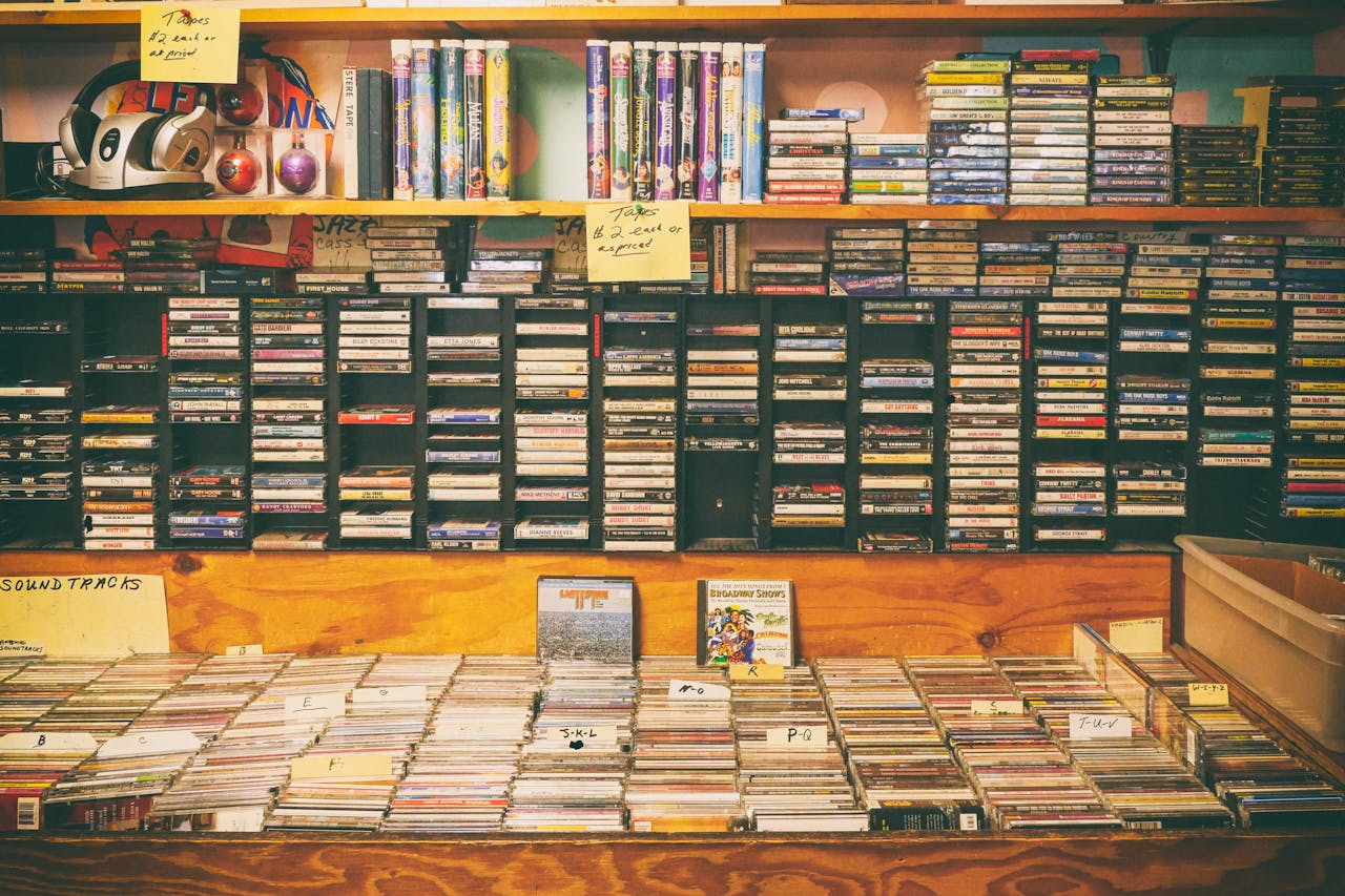 services-04 A nostalgic display of cassette tapes and CDs in a vintage record store.